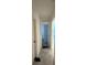 Hallway with tile floors connects to bedrooms, enhancing the home's flow and accessibility at 4812 Worchester Dr, Kissimmee, FL 34746