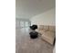 Spacious living room with bright windows, neutral tile, and ample space for furniture at 4812 Worchester Dr, Kissimmee, FL 34746