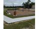 Community playground featuring swings and benches at 4812 Worchester Dr, Kissimmee, FL 34746
