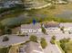 Scenic aerial view of townhomes and surrounding natural Florida landscape with ponds and lush greenery at 510 Captiva Dr, Davenport, FL 33896