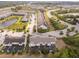 Aerial view of townhome in a community featuring ponds, mature trees and ample parking at 510 Captiva Dr, Davenport, FL 33896