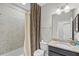 This full bathroom boasts an animal print curtain, granite countertop, and vanity at 510 Captiva Dr, Davenport, FL 33896