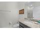 Bathroom with a granite countertop vanity, a modern sink, and a mirror, complete with stylish decor at 510 Captiva Dr, Davenport, FL 33896