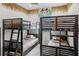 A bedroom featuring two sets of bunk beds, a giraffe mural, and a fun theme at 510 Captiva Dr, Davenport, FL 33896