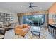 Inviting living space with comfortable seating, stylish furnishings, and a view of the outdoor pool area at 510 Captiva Dr, Davenport, FL 33896