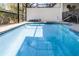 Sparkling screened-in pool featuring a tanning ledge and a whimsical unicorn float at 510 Captiva Dr, Davenport, FL 33896