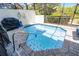 Private screened-in pool with brick pavers is perfect for relaxation and sunbathing at 510 Captiva Dr, Davenport, FL 33896