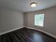 Naturally lit bedroom featuring updated flooring, neutral paint, and standard closet at 5161 Howison Rd, Kissimmee, FL 34746