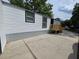 Picture of the home featuring a spacious side patio and neat exterior siding at 5161 Howison Rd, Kissimmee, FL 34746