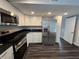 Modern kitchen featuring stainless steel appliances and dark granite countertops at 5161 Howison Rd, Kissimmee, FL 34746