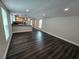 Spacious living room with modern flooring and neutral wall colors creating an open, airy space at 5161 Howison Rd, Kissimmee, FL 34746