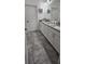 Bathroom featuring a granite countertop, double sinks, and tiled floors at 5340 Jubiloso Dr, St Cloud, FL 34771