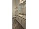 Bathroom featuring granite countertops, white cabinetry, and a shower with a polka-dot curtain at 5340 Jubiloso Dr, St Cloud, FL 34771
