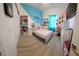 Well-lit bedroom with unique color scheme, decor, and wood flooring at 5340 Jubiloso Dr, St Cloud, FL 34771