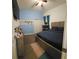 Cozy bedroom with blue accent wall, closet, and comfortable furnishings at 5340 Jubiloso Dr, St Cloud, FL 34771