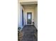 Inviting front entry with stone walkway, decorative 'Welcome' sign, and a modern glass-paneled door at 5340 Jubiloso Dr, St Cloud, FL 34771