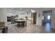 Spacious kitchen with stainless steel appliances, granite counters, an island with seating, and tile flooring at 5340 Jubiloso Dr, St Cloud, FL 34771
