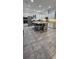 Large kitchen island with barstool seating, stainless appliances, granite countertops, and tiled floors at 5340 Jubiloso Dr, St Cloud, FL 34771
