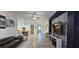Open floor plan showing kitchen, living room with modern furniture, tile floors, and stylish decor at 5340 Jubiloso Dr, St Cloud, FL 34771
