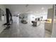 Open-concept living and kitchen area with modern lighting, tile floors, and ample space for entertaining at 5340 Jubiloso Dr, St Cloud, FL 34771