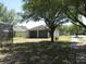 Backyard with grass and walkway and view of house at 563 Lake Davenport Cir, Davenport, FL 33837