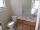 Bathroom with toilet, sink and mirror at 563 Lake Davenport Cir, Davenport, FL 33837