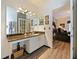 Bathroom featuring granite counters, modern vanity, and access to bedroom at 572 Nogales Ct, Kissimmee, FL 34758
