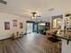 Open living area with hardwood floors, decorative lighting, and easy access to the backyard at 572 Nogales Ct, Kissimmee, FL 34758