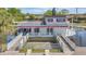A unique houseboat, featuring outdoor railings and a surrounding pond, creates a memorable image at 5912 Village Cir # Ge, Orlando, FL 32822