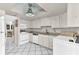 Functional kitchen featuring white appliances, countertops, and abundant cabinet space at 5912 Village Cir # Ge, Orlando, FL 32822