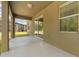 Covered patio with sliding glass door access, overlooking a lawn and screened-in pool at 6137 Waterside Island Ln, Winter Garden, FL 34787