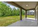 Spacious backyard with a covered patio and view of the screened-in pool at 6137 Waterside Island Ln, Winter Garden, FL 34787