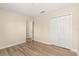 Bedroom featuring hardwood floors, neutral walls, and a closet at 6137 Waterside Island Ln, Winter Garden, FL 34787