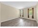 Bright and airy bedroom with hardwood floors, neutral walls, and ample natural light from two windows at 6137 Waterside Island Ln, Winter Garden, FL 34787