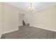 Open-concept living room with hardwood floors and staircase view at 6137 Waterside Island Ln, Winter Garden, FL 34787