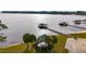 Aerial view showcasing the lakefront property with docks, boat houses, and lush surroundings at 6186 Oak Shore Dr, St Cloud, FL 34771