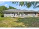 Home backyard featuring a patio with outdoor seating and a fire pit area at 6186 Oak Shore Dr, St Cloud, FL 34771