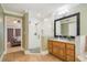 Open bathroom featuring glass shower with tile surround and wooden vanity at 6186 Oak Shore Dr, St Cloud, FL 34771