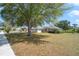 Single-story home with a well-maintained lawn and mature trees at 6186 Oak Shore Dr, St Cloud, FL 34771