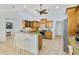 Bright kitchen with granite counters, an island with barstool seating, and stainless steel appliances at 6186 Oak Shore Dr, St Cloud, FL 34771