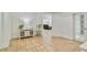 Open living area with tile flooring, white walls, and a view into the living room at 6186 Oak Shore Dr, St Cloud, FL 34771