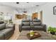 Inviting living room showcasing tile flooring, comfortable sofas, and an open floor plan at 6186 Oak Shore Dr, St Cloud, FL 34771