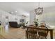 Open-concept living room with dining area and view into the living room at 6186 Oak Shore Dr, St Cloud, FL 34771