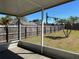 Backyard featuring a secure wood fence, lush lawn, and shaded areas with mature trees at 633 Cypress Tree Ct, Orlando, FL 32825