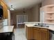 Open kitchen view showcases ample counter space and bright natural light at 633 Cypress Tree Ct, Orlando, FL 32825