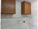 Laundry room features wood cabinets, a wire rack for storage, and hookups for appliances at 633 Cypress Tree Ct, Orlando, FL 32825