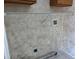 Close-up of laundry room area with neutral paint, white wire shelf, and appliance hookups at 633 Cypress Tree Ct, Orlando, FL 32825
