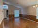 Inviting living room featuring hardwood floors, ample natural light, and neutral paint tones at 633 Cypress Tree Ct, Orlando, FL 32825