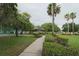 The community grounds feature lush landscaping, walking paths, and mature trees, creating a serene environment at 742 Chamberlin Trl, St Cloud, FL 34772