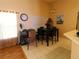 Casual dining area featuring tile floors, a modern light fixture, and neutral colors at 742 Chamberlin Trl, St Cloud, FL 34772